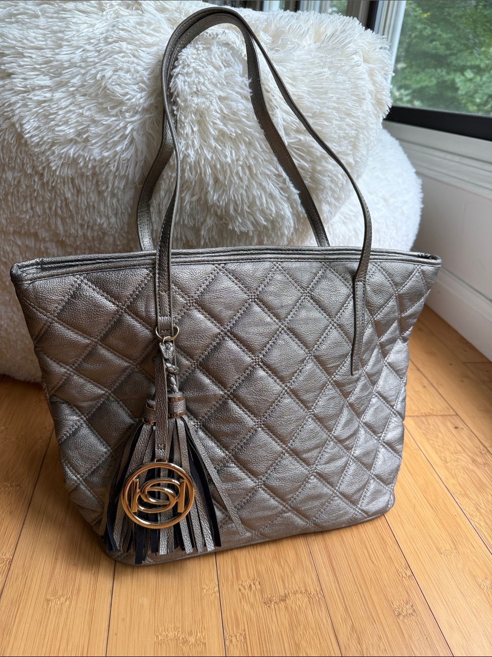 BEBE Quilted Metallic ChampagneTint Silver Tote Bag with Tassel Charm - Like New